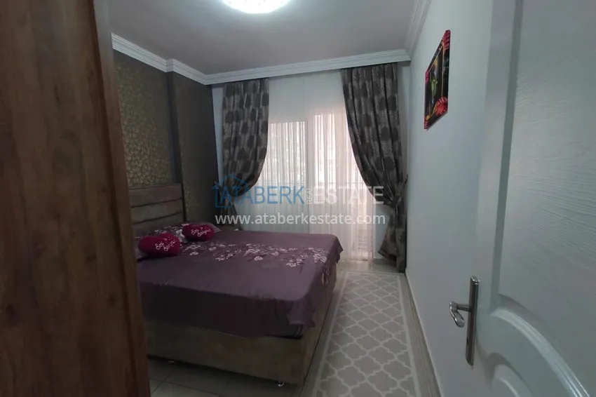 Приобрести Двухкомная квартира в Махмутларе с мебелью в комплексе с бассейном 11 