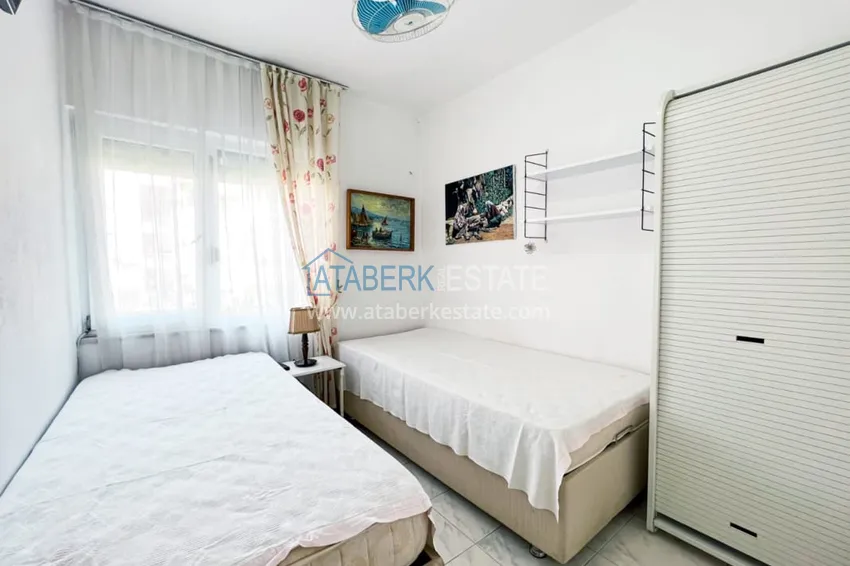 Приобрести Просторная двухкомнатная квартира с мебелью и камином в районе Алании – Конаклы 11 