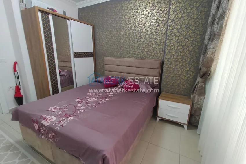 Приобрести Двухкомная квартира в Махмутларе с мебелью в комплексе с бассейном 12 