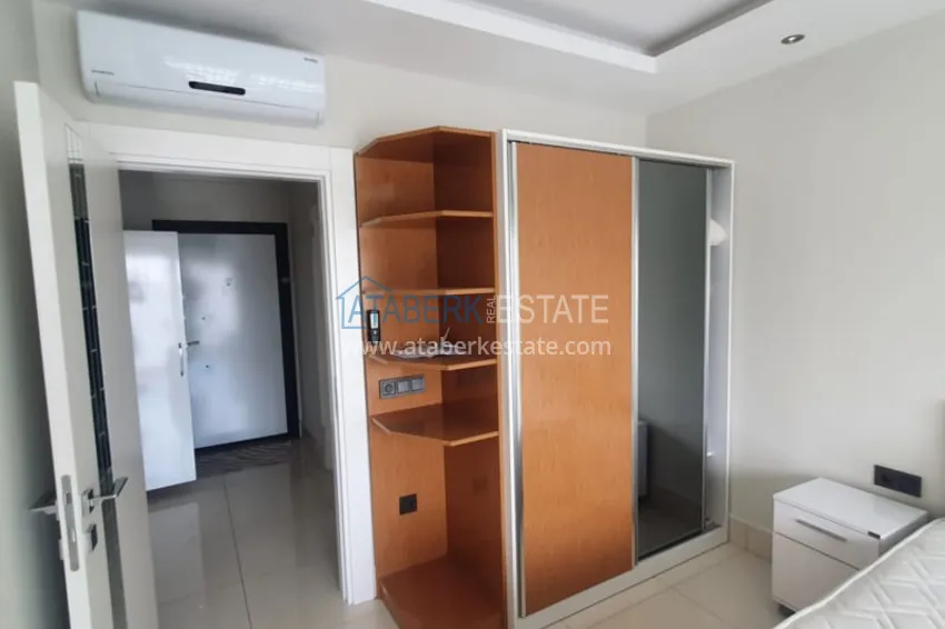 Приобрести Квартира 1+1 с мебелью рядом с морем в районе открытом для ВНЖ, Тосмур  13 