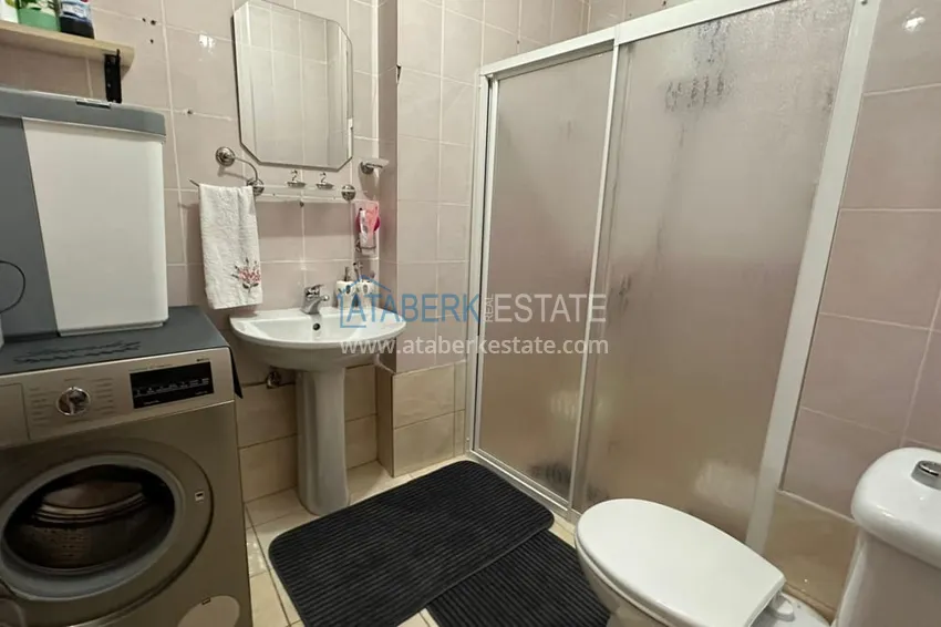 Приобрести Трехкомнатная квартира с открытым видом на горы и море в центре Алании 10 