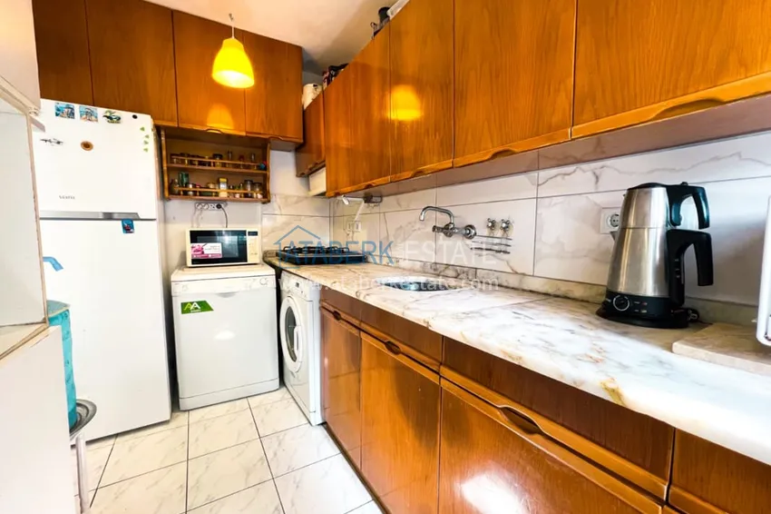 Приобрести Просторная двухкомнатная квартира с мебелью и камином в районе Алании – Конаклы 13 