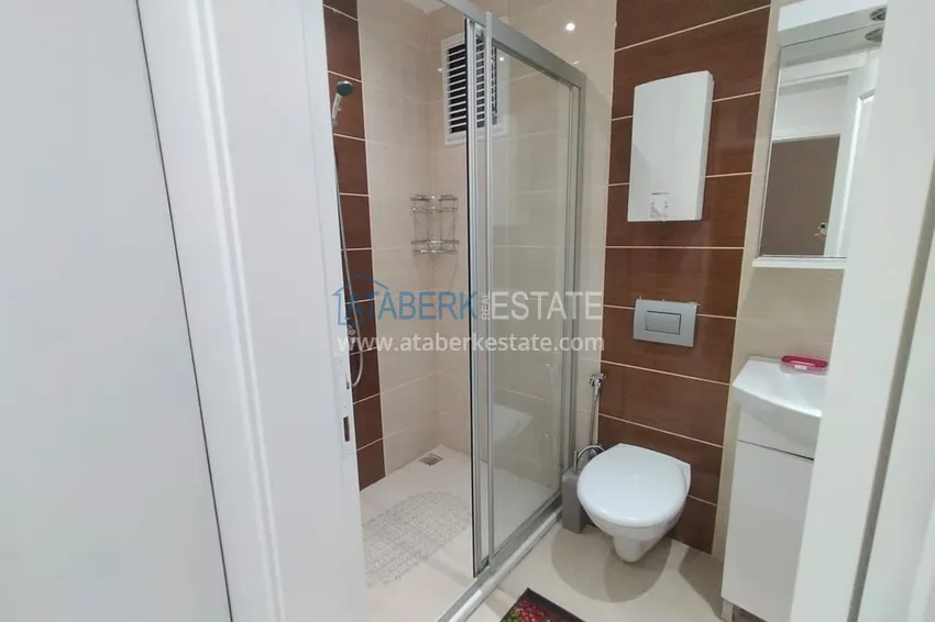 Приобрести Двухкомная квартира в Махмутларе с мебелью в комплексе с бассейном 15 