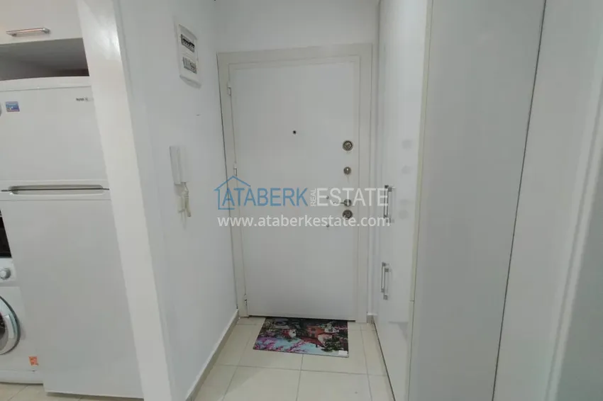 Приобрести Двухкомная квартира в Махмутларе с мебелью в комплексе с бассейном 1 