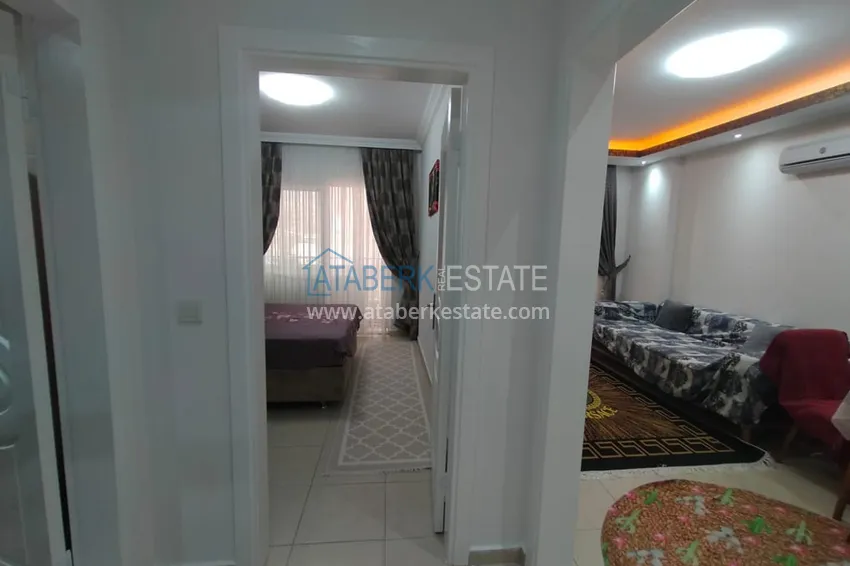 Приобрести Двухкомная квартира в Махмутларе с мебелью в комплексе с бассейном 2 