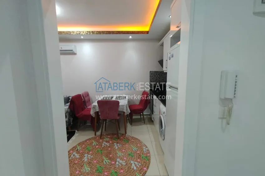 Приобрести Двухкомная квартира в Махмутларе с мебелью в комплексе с бассейном 3 