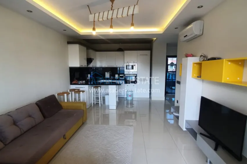 Приобрести Квартира 1+1 с мебелью рядом с морем в районе открытом для ВНЖ, Тосмур  4 