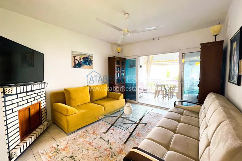 Приобрести Просторная двухкомнатная квартира с мебелью и камином в районе Алании – Конаклы 4 