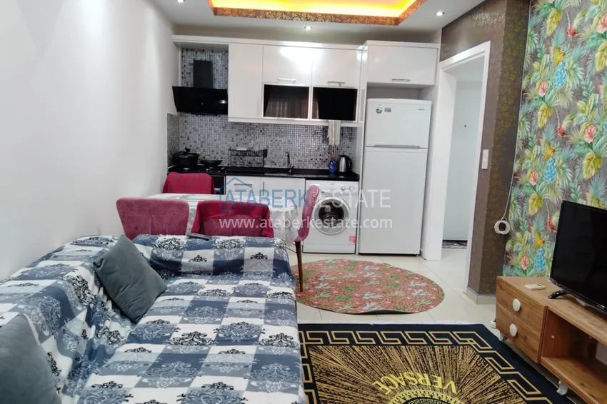 Приобрести Двухкомная квартира в Махмутларе с мебелью в комплексе с бассейном 6 