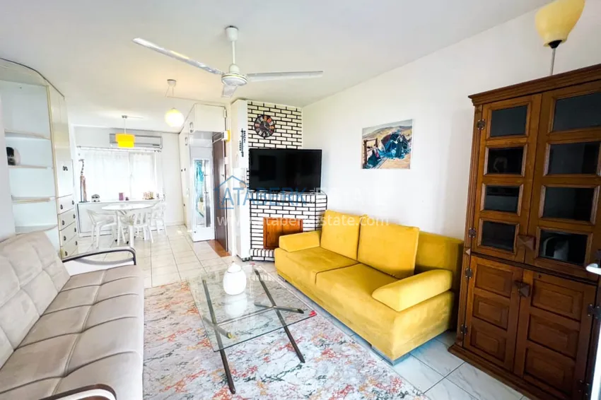 Приобрести Просторная двухкомнатная квартира с мебелью и камином в районе Алании – Конаклы 5 