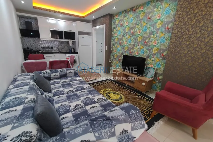 Приобрести Двухкомная квартира в Махмутларе с мебелью в комплексе с бассейном 7 