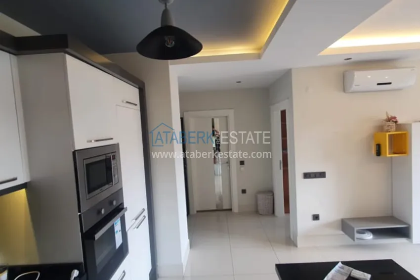 Приобрести Квартира 1+1 с мебелью рядом с морем в районе открытом для ВНЖ, Тосмур  8 