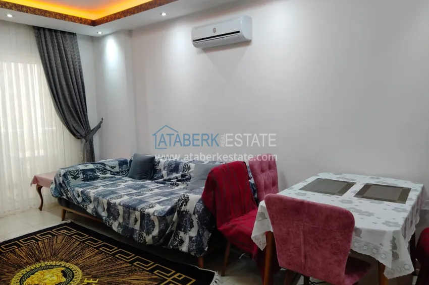 Приобрести Двухкомная квартира в Махмутларе с мебелью в комплексе с бассейном 9 