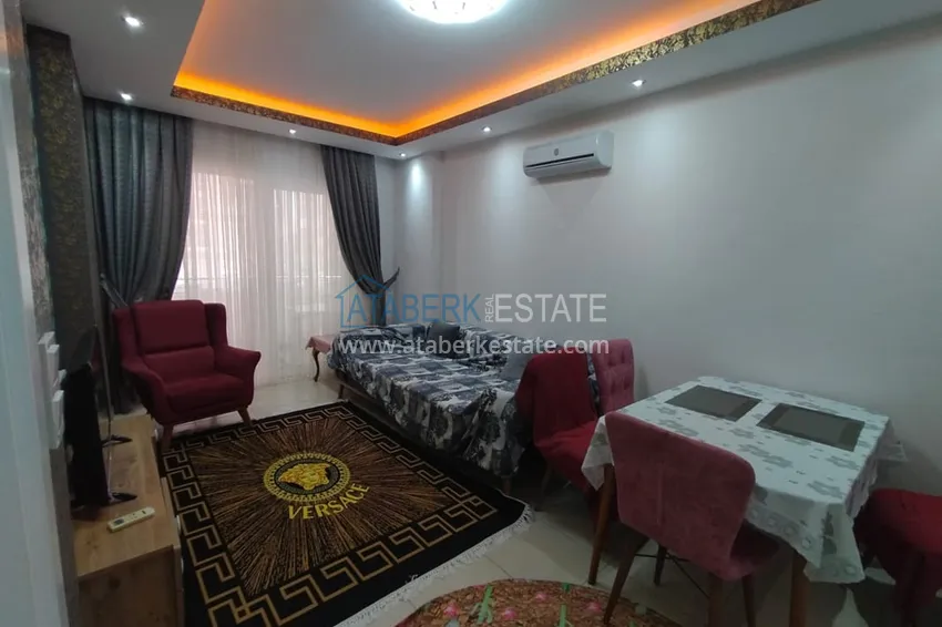 Приобрести Двухкомная квартира в Махмутларе с мебелью в комплексе с бассейном 10 