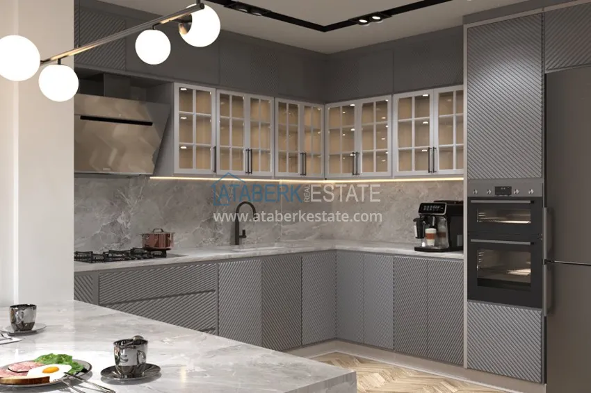 Приобрести Квартиры 2+1 на этапе строительства в районе Давултепе-Мерсин 9 