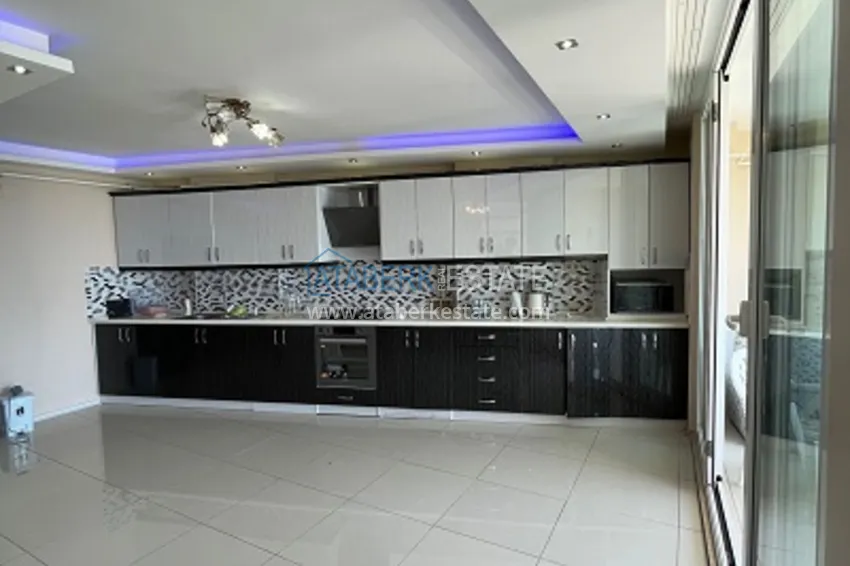 Приобрести Квартира 3+1 меблированная с открытым видом на море в районе Акдениз-Мерсин 5 