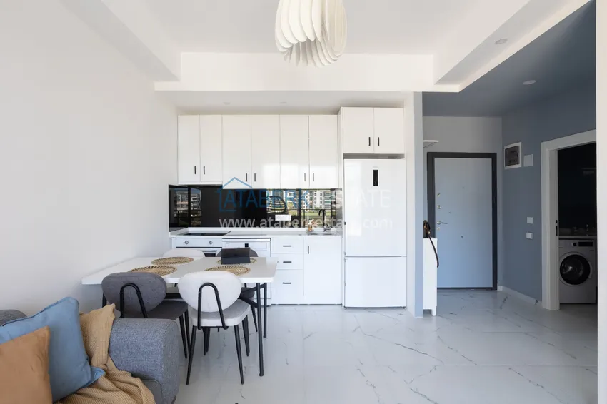 Приобрести Квартира 1+1 меблированная с дизайнерским интерьером в новостройке, район Авсаллар – Алания. Подходит для краткосрочной аренды 10 