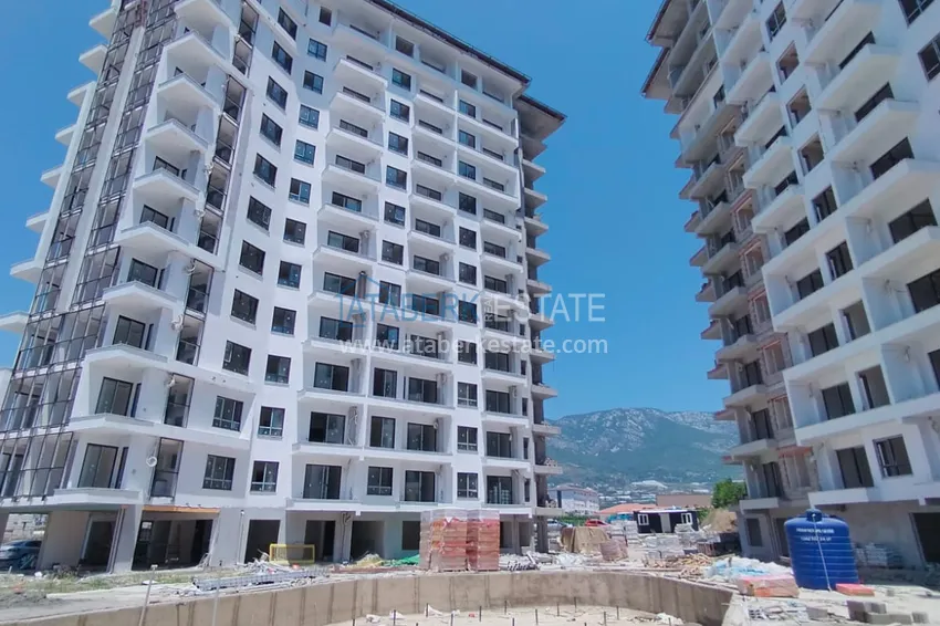 Фото -  Квартира 1+1 от инвестора в жилом комплексе на этапе строительства, район Махмутлар, Алания, 60 кв.м, 5 этаж 1 