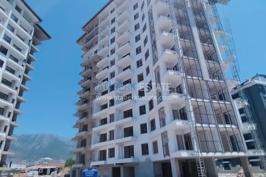 Фото -  Квартира 1+1 от инвестора в жилом комплексе на этапе строительства, район Махмутлар, Алания, 60 кв.м, 5 этаж 2 