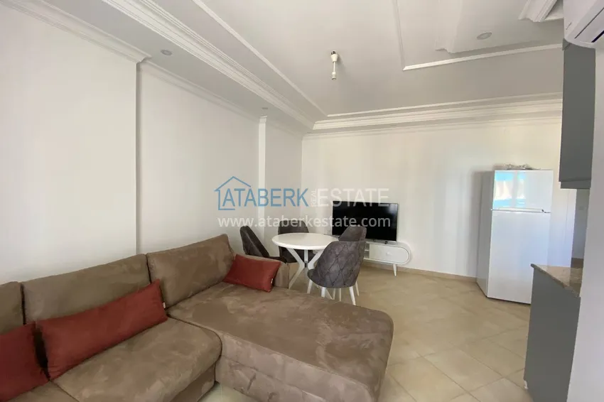 Приобрести Двухкомнатная квартира с мебелью и видом на море в комплексе на первой береговой, район Тосмур – Алания  5 