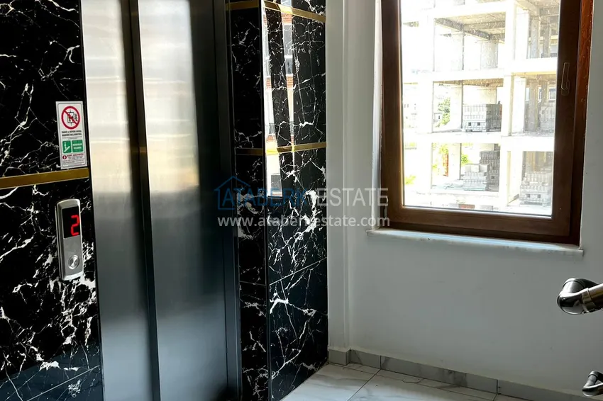 Квартира 1+1 меблированная в Газипаше в молодом комплексе городского типа 7 