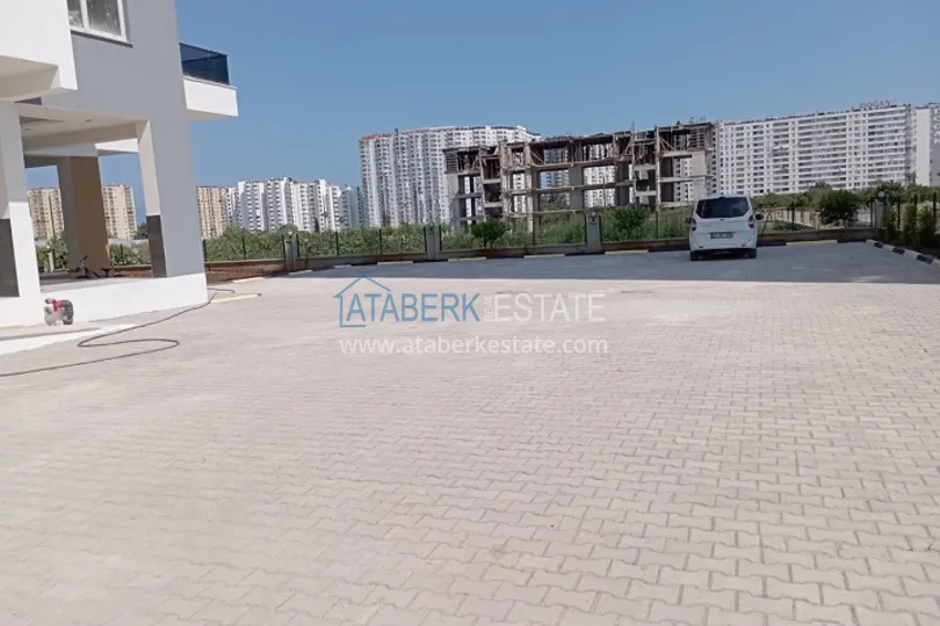 Квартира 1+1 с чистовой отделкой, частично вид на море и горы в районе Томюк-Мерсин 3 