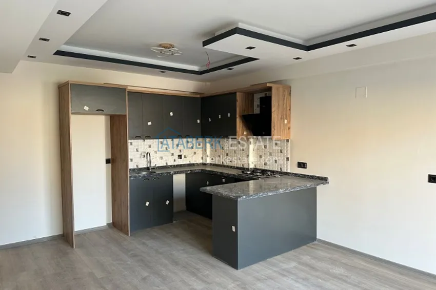 Приобрести Квартира 1+1 с чистовой отделкой в новом жилом комплексе район Арпачбахшиш – Мерсин 1 