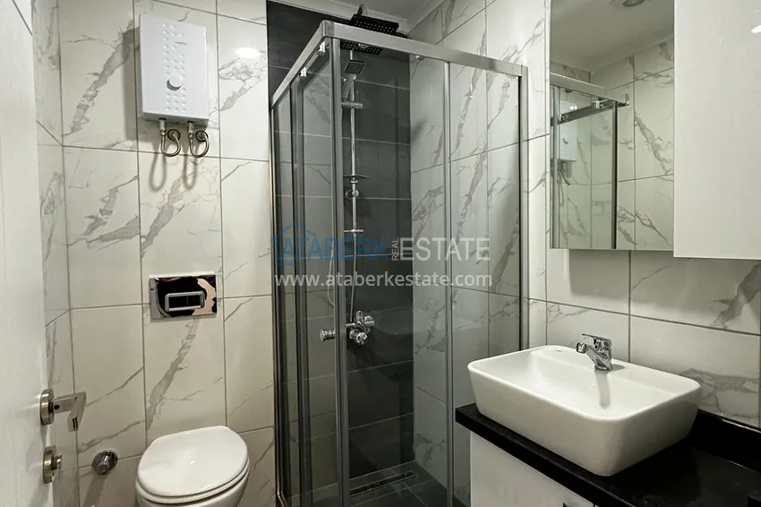 Приобрести Квартира 1+1 меблированная в новом жилом комплексе с инфраструктурой, район Махмутлар – Алания 11 