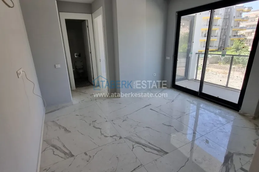 Приобрести Компактная двухкомнатная квартира с чистовой отделкой в 3-х минутах от моря - центр Алании 3 