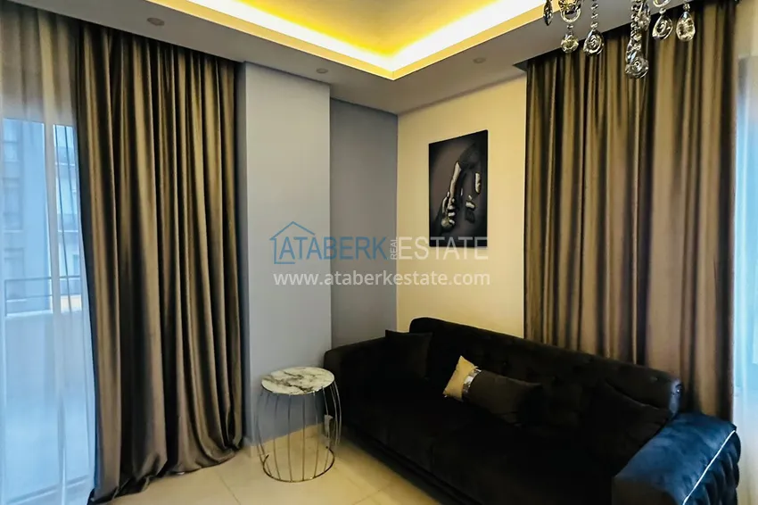 Приобрести Квартира 1+1 меблированная в новом жилом комплексе с инфраструктурой, район Махмутлар – Алания 4 