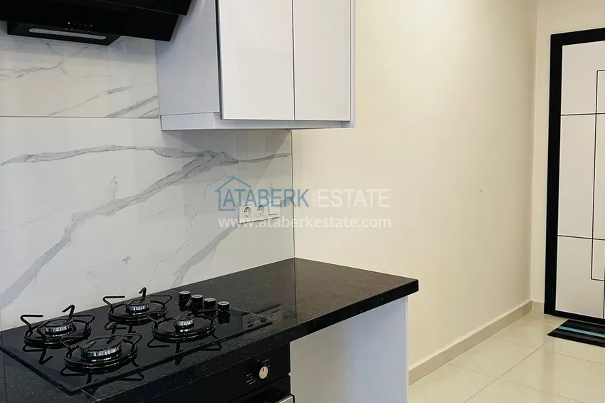 Приобрести Квартира 1+1 меблированная в новом жилом комплексе с инфраструктурой, район Махмутлар – Алания 6 