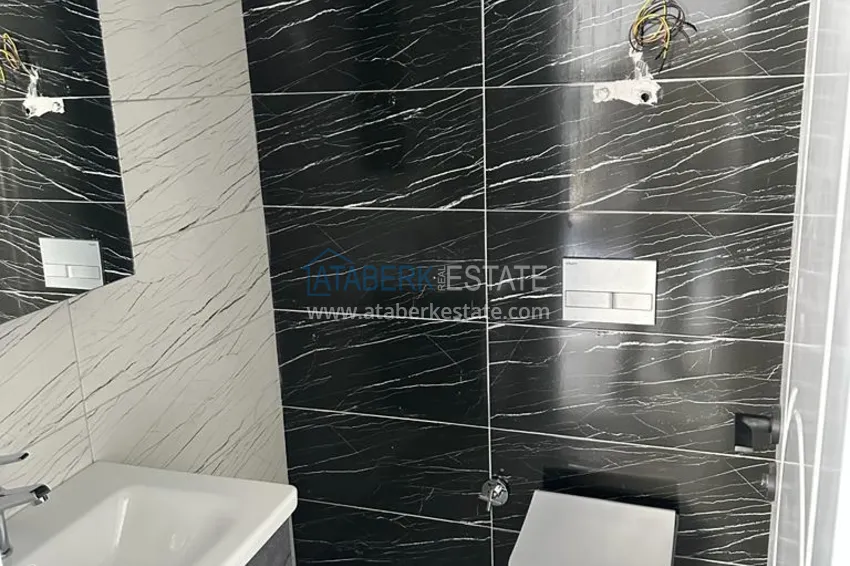 Приобрести Двухкомнатная квартира в Алании в новом современном комплексе - район Оба 6 