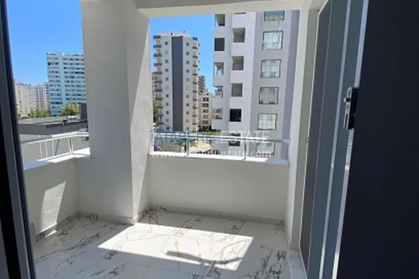 Приобрести Квартира 2+1 с чистовой отделкой в популярном районе Арпачбахшиш – Мерсин 16 