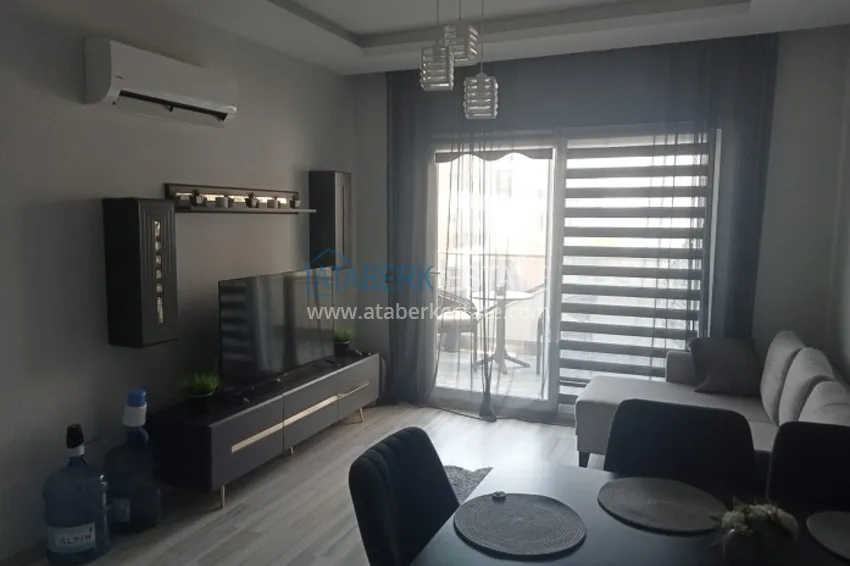 Приобрести Квартира 1+1 в молодом комплексе в 350 метрах от моря Арпачбахшиш – Мерсин 1 