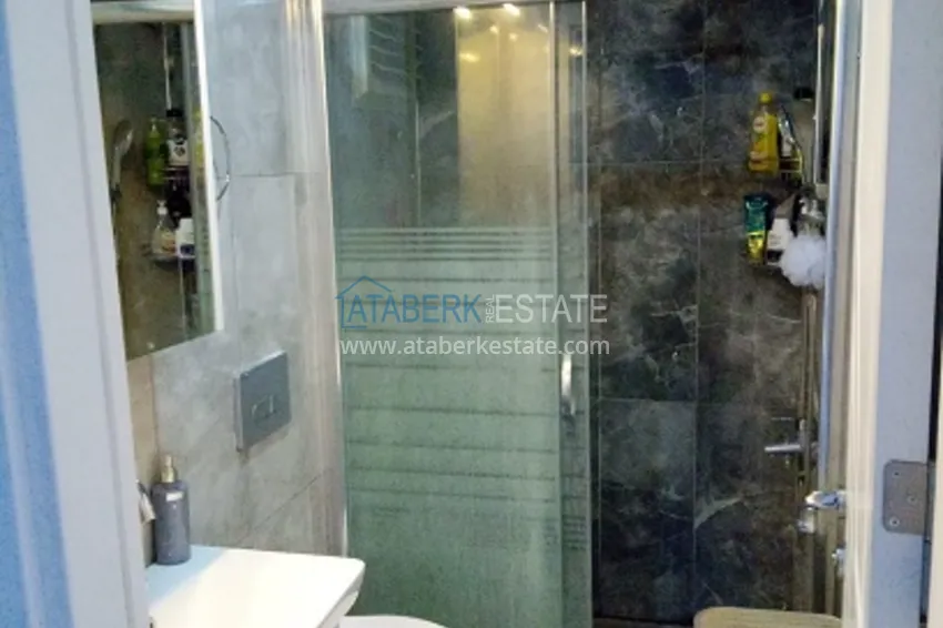 Приобрести Квартира 1+1 в молодом комплексе в 350 метрах от моря Арпачбахшиш – Мерсин 11 