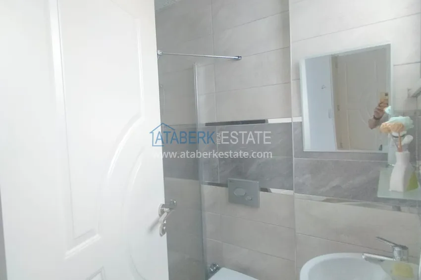 Приобрести Квартира 2+1 меблированная в комфортабельном комплексе всего в 200 метрах от моря, район Махмутлар – Алания 12 