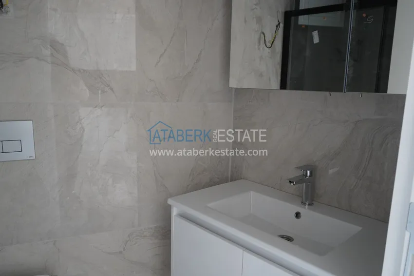 Приобрести Квартира 1+1 с чистовой отделкой в современном городском доме в самом центре Алании 12 