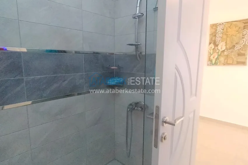 Приобрести Квартира 2+1 меблированная в комфортабельном комплексе всего в 200 метрах от моря, район Махмутлар – Алания 13 