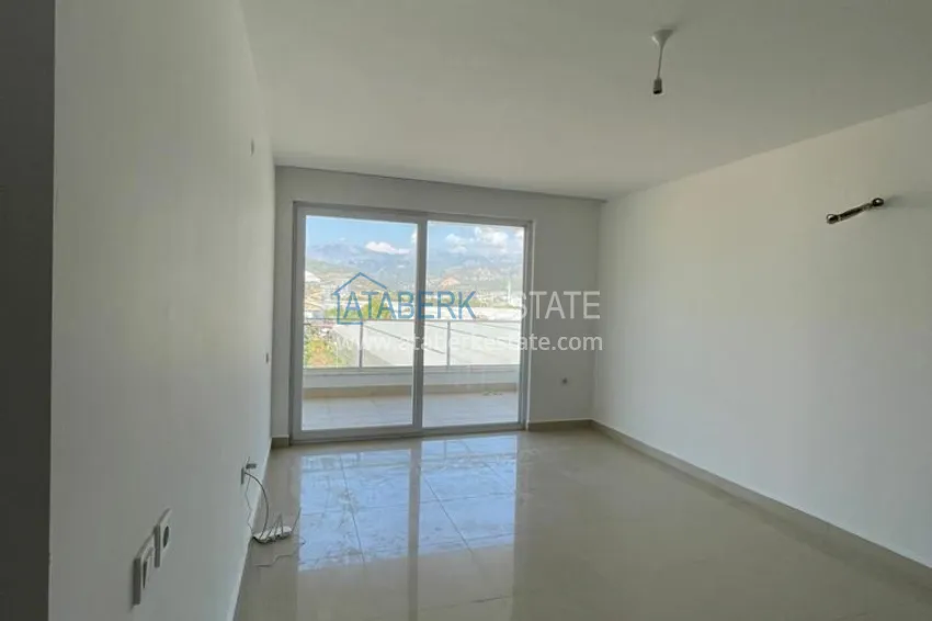 Приобрести Квартира 2+1 с видом на горы и крепость в комплексе комфорт-класса с собственным пляжем, район Демирташ – Алания 1 