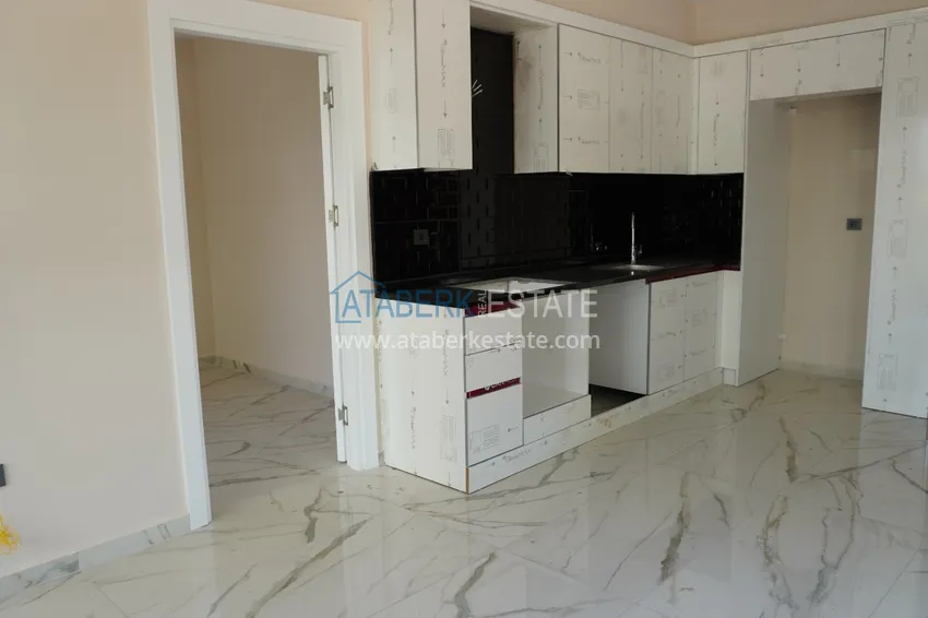 Приобрести Квартира 1+1 с чистовой отделкой в современном городском доме в самом центре Алании 4 