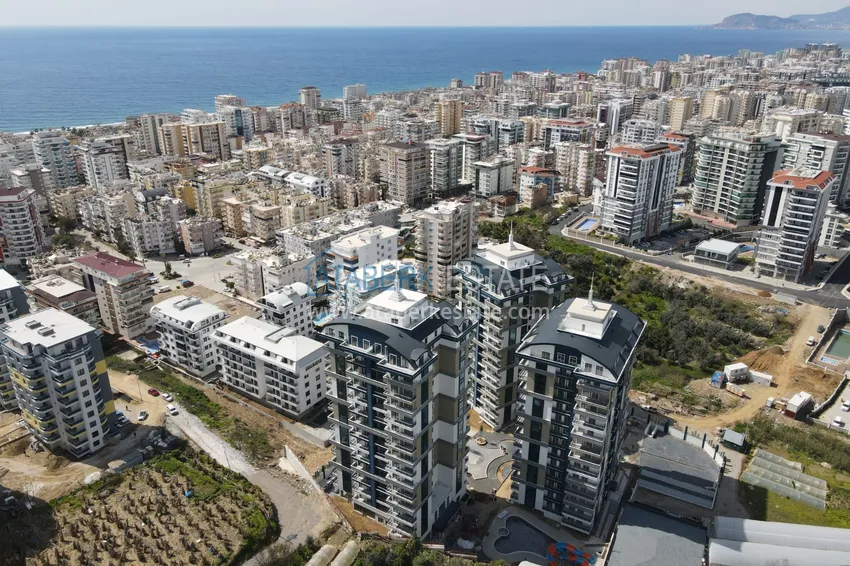 Квартира 1+1 с мебелью и видом на море в комплексе отельного типа, район Махмутлар – Алания 1