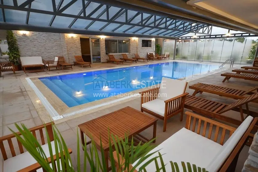 Квартира 2+1 меблированная с отдельной кухней, застеклённым балконом и видом на море, район Кестель – Алания 11 