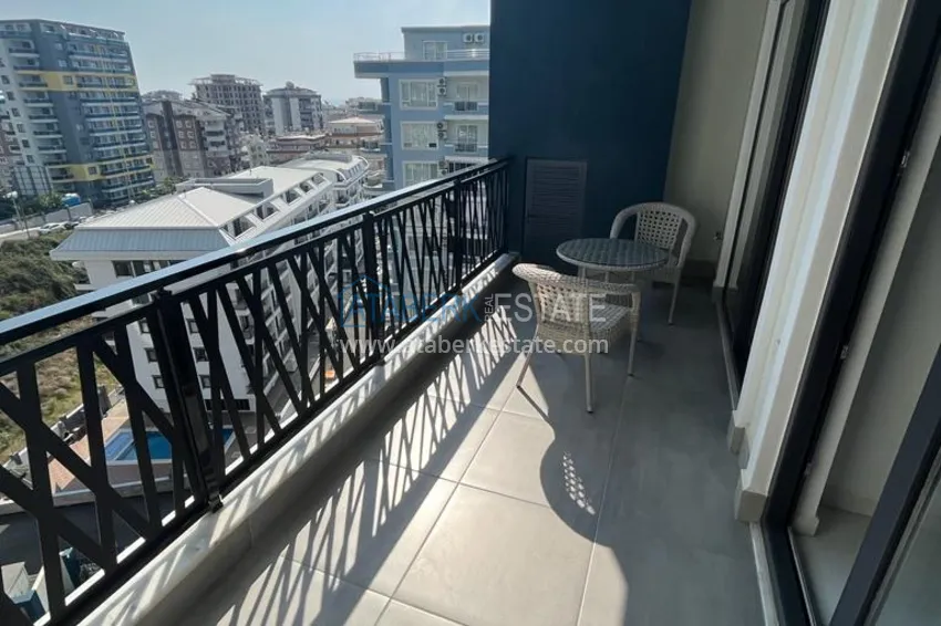 Приобрести Квартира 1+1 с мебелью и видом на море в комплексе отельного типа, район Махмутлар – Алания 12