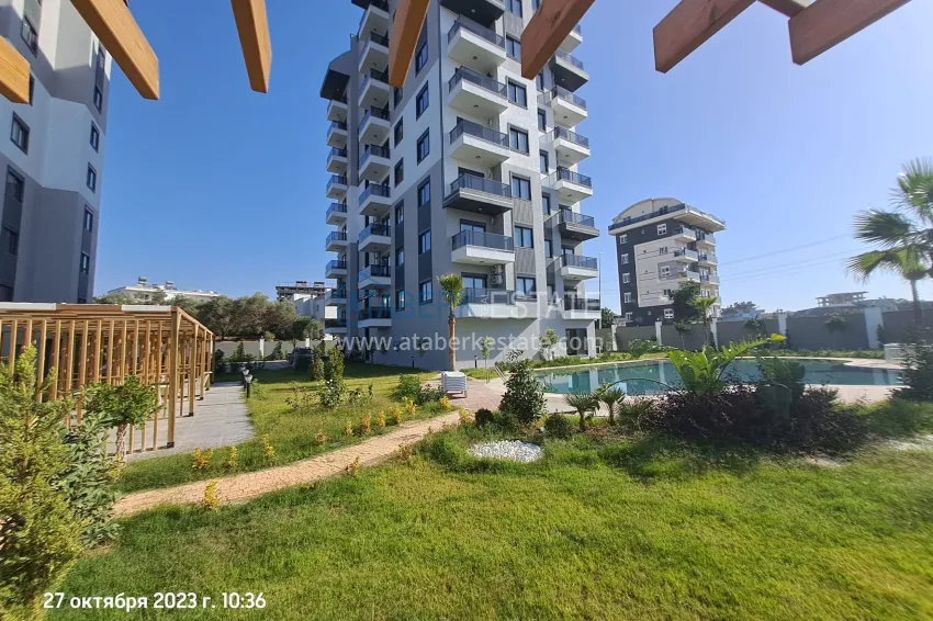 Квартира 1+1 с качественной чистовой отделкой и боковым видом на горы в новом комплексе – Алания, район Авсаллар  1 