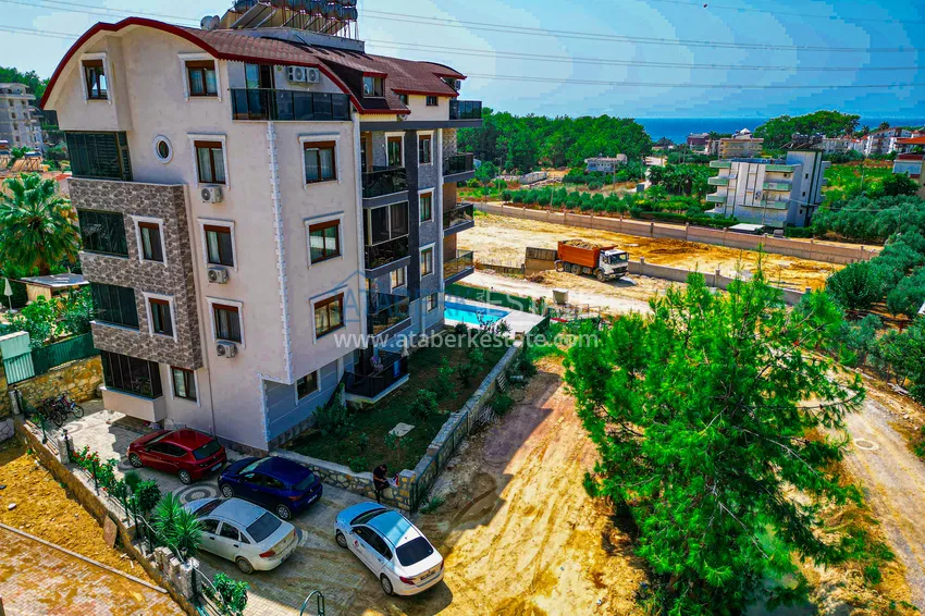 Пентхаус-дуплекс 4+1 с мебелью и боковым видом на море в районе Авсаллар 1 