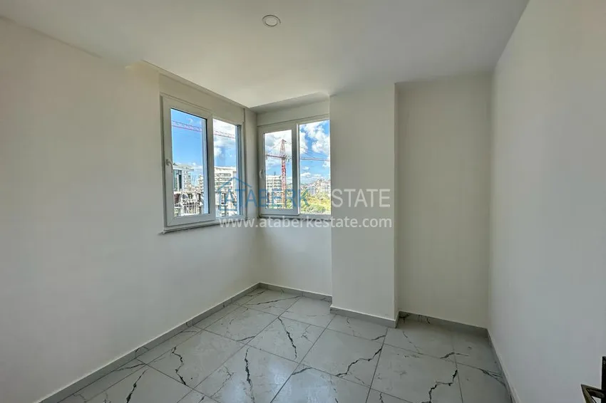 Приобрести Квартира 2+1 в Авсалларе с частичным видом на море в новом комплексе. Подходит для краткосрочной аренды 7 