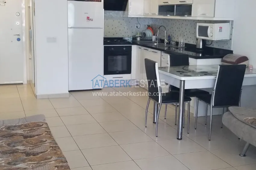 Приобрести Квартира 1+1 в районе Авсаллар с мебелью и видом на море в комплексе с концепцией отеля 9 