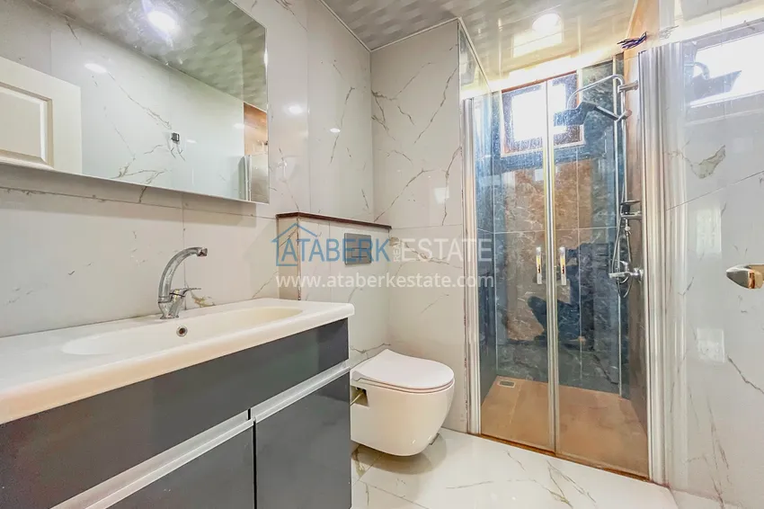 Приобрести Пентхаус-дуплекс 4+1 с мебелью и боковым видом на море в районе Авсаллар 9 