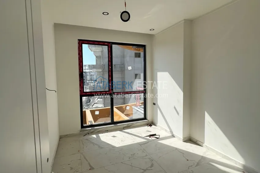 Приобрести Двухкомнатная квартира с чистовой отделкой в комфортабельном комплексе – Алания, район Авсаллар 7