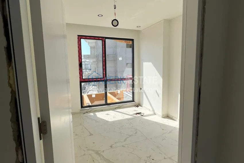 Приобрести Двухкомнатная квартира с чистовой отделкой в комфортабельном комплексе – Алания, район Авсаллар 10